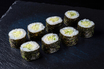 Set fresh delicious Japanese sushi on dark background