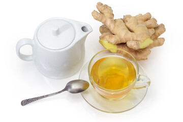 Ginger tea in cup and teapot against fresh ginger roots