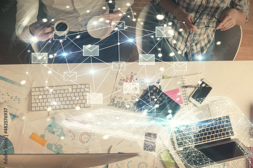 Poster double exposure of man and woman working together and the envelop hologram drawing. computer backgro