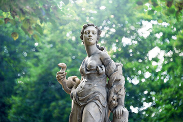 Fototapeta premium Sandstone statues in the Saxon Garden, Warsaw, Poland. Made before 1745 by anonymous Warsaw sculptor under the direction of Johann Georg Plersch. Statues of Greek mythical muses