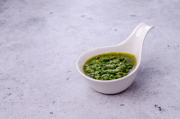 Green sauce in ceramic dishes