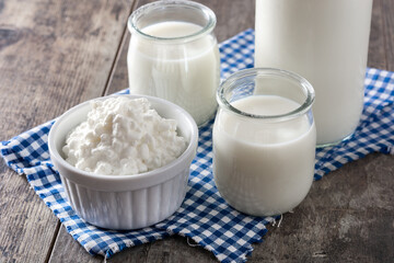 Milk kefir drink on wooden table. Liquid and fermented milk product on wooden table