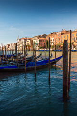 Fototapeta na wymiar Gondole and typical buildings at Venice, Italy