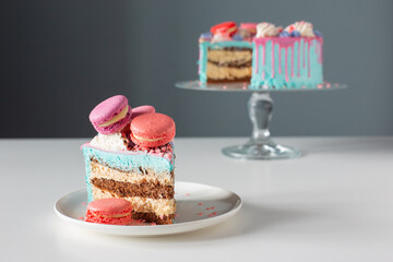 piece of cake with pink and blue decor on white table