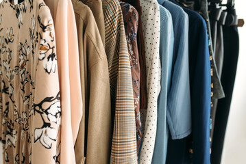 Capsule of casual clothes in beige and blue colors closeup