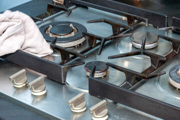 cleaning a metal kitchen stove