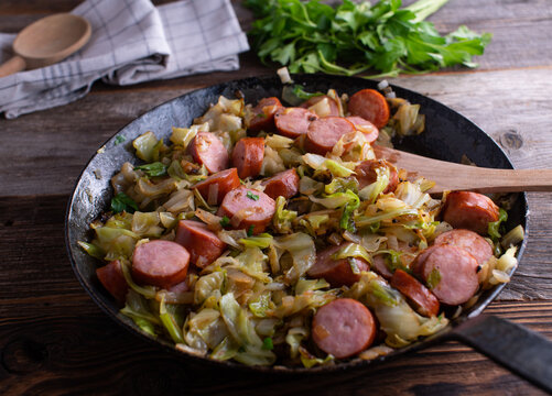 Fried cabbage with krakauer sausages
