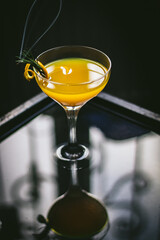 Orange fresh juice on a dark background.