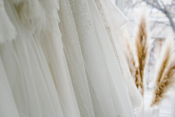 Fototapeta na wymiar Wedding salon with designer dresses. Beautiful designer dresses.