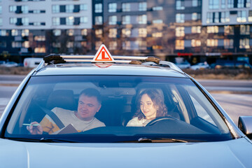 Driving school and people concept. Beautiful young woman passed driving school test. View through the windshield.