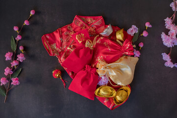 Chinese new year festival decorations pow or red packet, orange and gold ingots or golden lump on a...