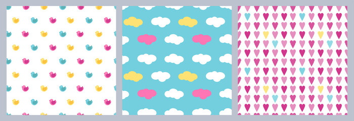 A set of seamless vector children's patterns with birds, hearts and clouds. Cute Colored Flat Patterns for Babies