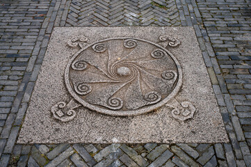 Carved stone slabs with traditional patterns on the streets of ancient towns in China