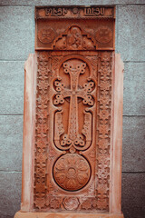 Khachkar carved from red stone