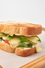 Appetizing sandwich with cheese and greens