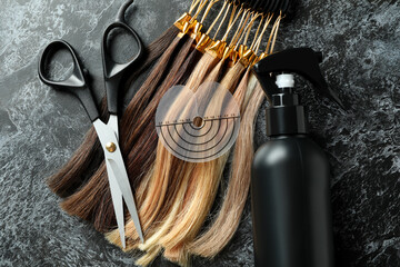 Composition with hair extension accessories on dark background