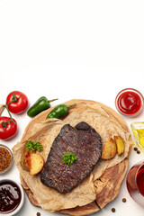 Concept of tasty food with beef steak on white background