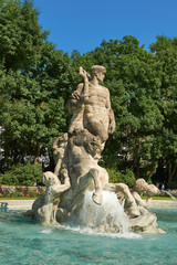 Fototapeta na wymiar Neptune fountain in the old botanical garden in Munich