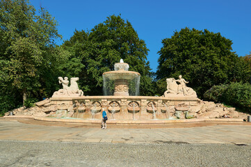 Fototapeta premium People around Wittelsbach Fountain in Munich