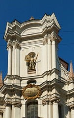 Fototapeta na wymiar Baroque portal and pediment of the Church of the Holy Trinity in Munich