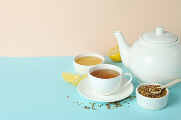 Concept of hot drink with buckwheat tea on blue table