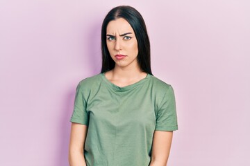 Fototapeta premium Beautiful woman with blue eyes wearing casual t shirt skeptic and nervous, frowning upset because of problem. negative person.