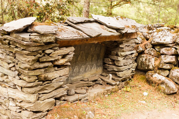 Fototapeta premium Prayer stone wall on the road in the Himalayas