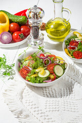 Vegetable salad with cucumber, tomato, sweet pepper in a white plate
