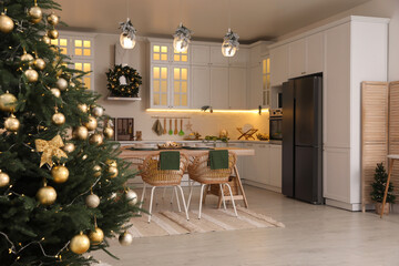 Cozy open plan kitchen decorated for Christmas. Interior design