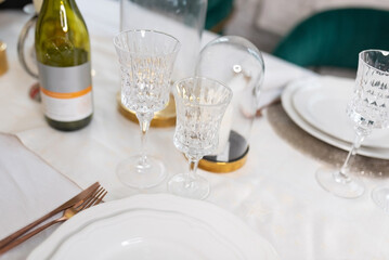 Table setting with dishes and glasses.