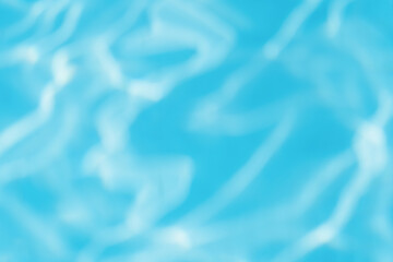 Beautiful bright sunny surface of swimming pool water with rippling wavy glowing blue transparent water. Abstract water surface with rippling waves background