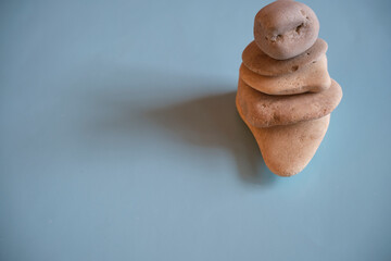 Harmony Concept. Harmony and Positive Mind. Hand Setting Natural Pebble Stone to Balance. Balancing...