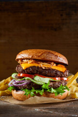 Burger with cutlets on table