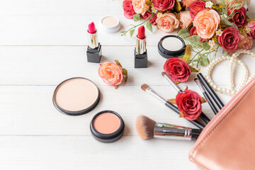 Obraz na płótnie Canvas Valentine Gift. Makeup cosmetics tools background and beauty cosmetics, products and facial cosmetics package with flower rose and Pearl necklace. Lifestyle and Valentine