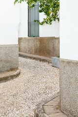A street with white houses in a Mediterranean town Almonaster la Real, Spain. The topic of travel to Europe. Spain.