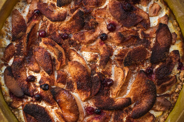 Baked apples with cinnamon on homemade cheesecake.