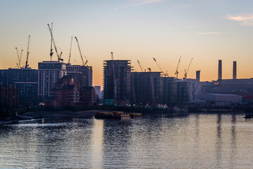 Obraz premium View of Battersea Power Station housing development at dusk over the river Thames, Vauxhall, London, England, UK