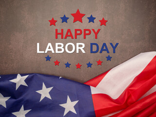 Top view of Happy labor day text over a vintage floor background and American flag.