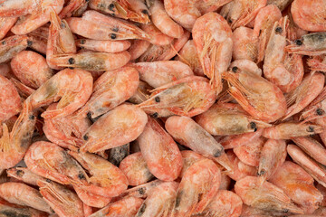 Unpeeled  frozen shrimp background texture