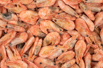 Unpeeled  frozen shrimp background texture
