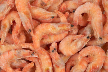 Unpeeled  frozen shrimp background texture
