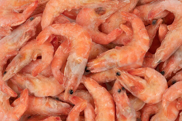 Unpeeled  frozen shrimp background texture