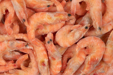 Unpeeled  frozen shrimp background texture