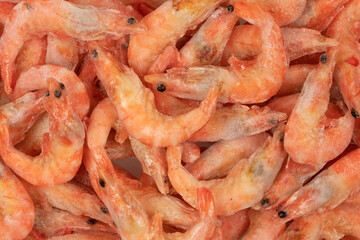 Unpeeled  frozen shrimp background texture