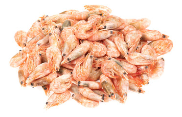 Unpeeled frozen shrimp on a white background