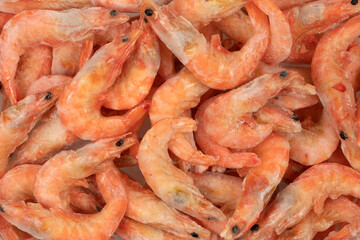 Unpeeled  frozen shrimp background texture