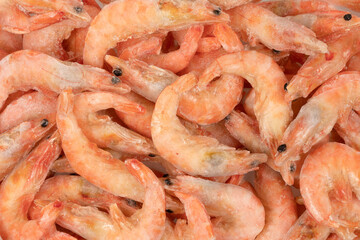 Unpeeled  frozen shrimp background texture