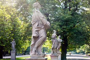 Naklejka premium Sandstone statues in the Saxon Garden, Warsaw, Poland. Made before 1745 by anonymous Warsaw sculptor under the direction of Johann Georg Plersch