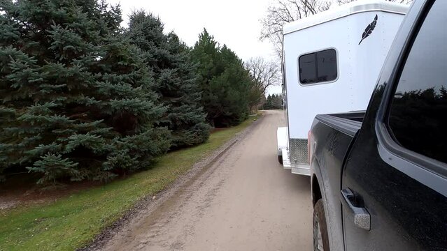 Hauling a horse trailer on a dirt road in Southeast Michigan - 4K