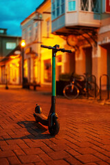 Electric scooter in the old city in the evening.